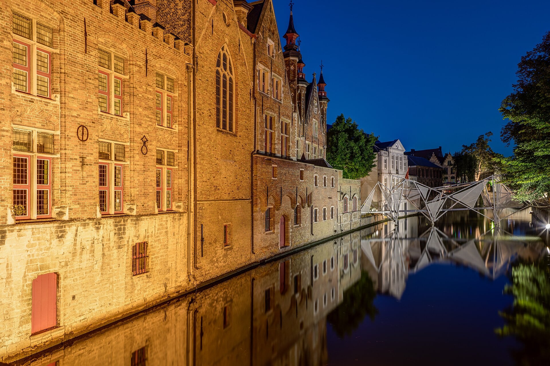 Gabled houses along a canal in Bruges, Belgium.
