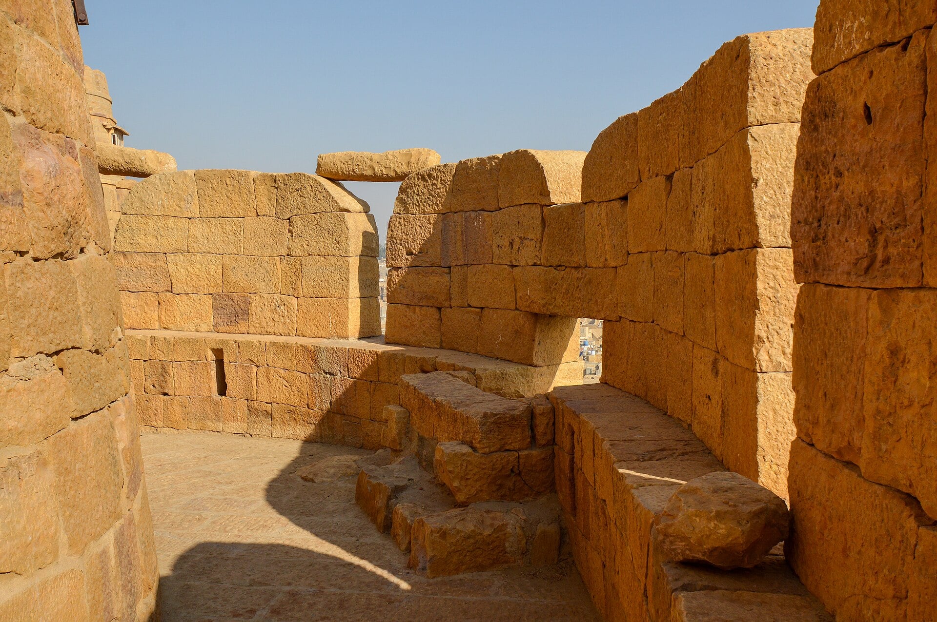 Sandstone battlements on the ramparts of Jaisalmer Fort, Rajasthan, in low winter light.