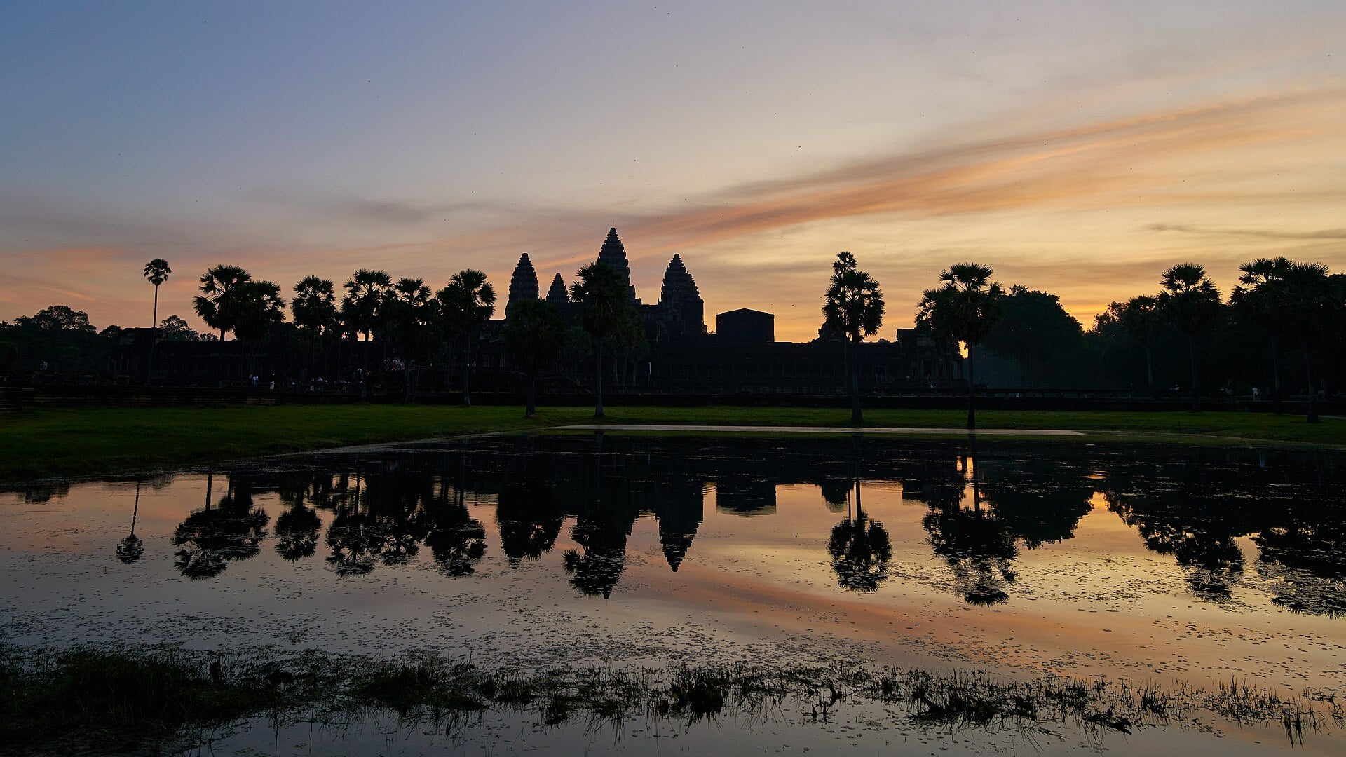 Angkor Wat, Cambodia, reflected in the temple moat at dawn.