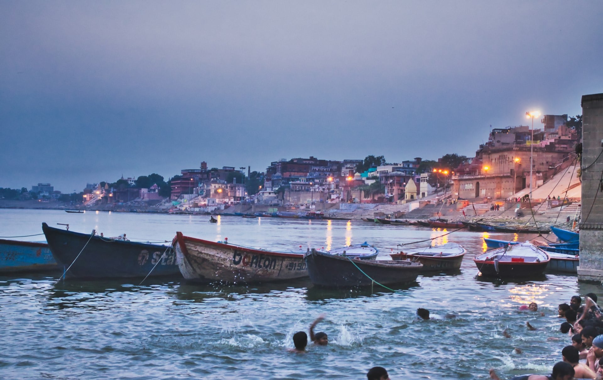 Boatman rowing on the Ganges at sunrise, Varanasi